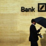 banking-blog-man-walking-past-deutsche-bank-offices-in-london